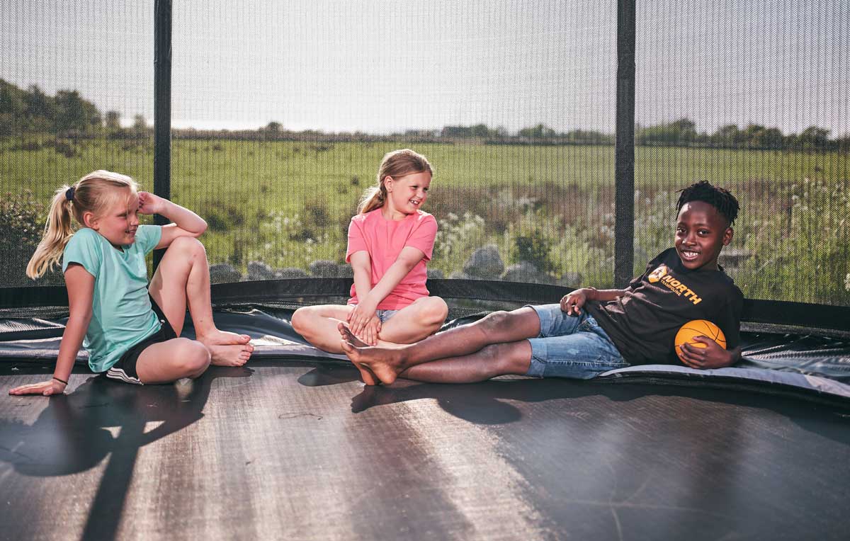 Kids on oval trampoline